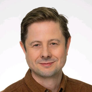Head shot of Phil Alampi, Chief Revenue Officer at Aclaimant